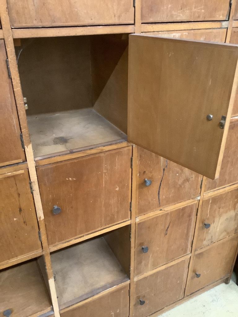 A mid 20th century locker cabinet (one door missing), width 128cm, depth 33cm, height 168cm